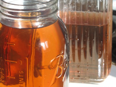 freshly-brewed mint tea in a jar and a pitcher