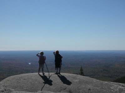 Zion and Elijah on a rock outcropping on Mount Monadnock looking out into the distance