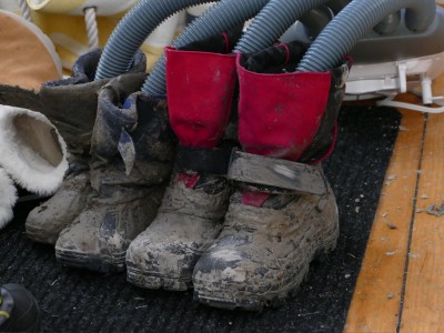 Harvey and Zion's snow boots completely encased in mud