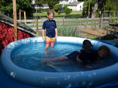 the boys in the pool on the deck
