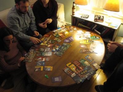 lots of colored cards on our coffee table: 7 Wonders