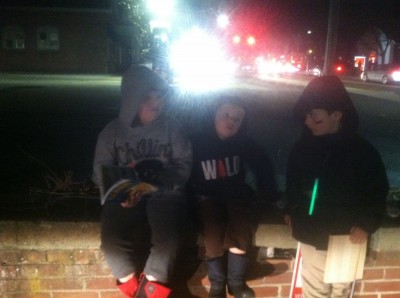 Harvey, Zion, and Julen looking cool sitting on a wall at night