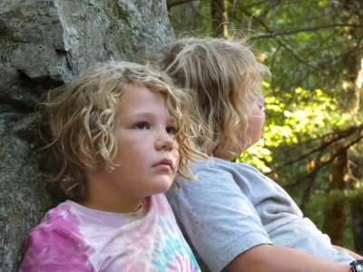 Elijah and Zion relaxing in the late-afternoon woods