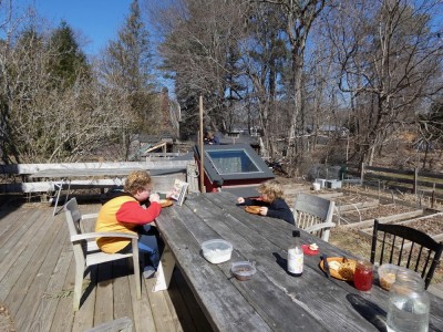 the boys eating lunch outside on the deck
