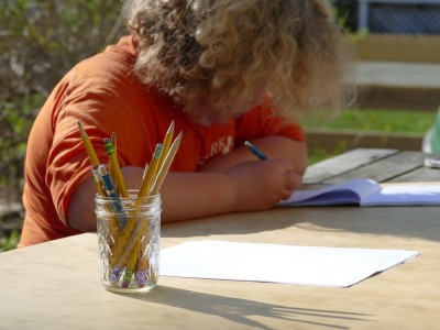 Harvey drawing at the picnic table