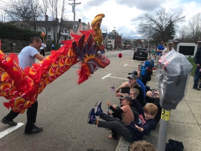 a chinese dragon surprising the boys at the parade