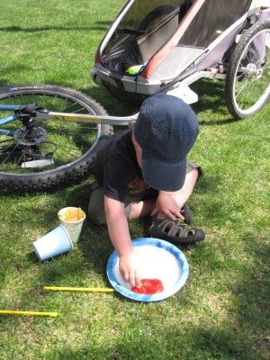 Harvey dipping fries in ketchup at the parade