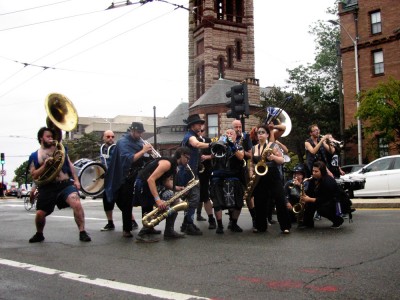 band members striking a pose on the parade route
