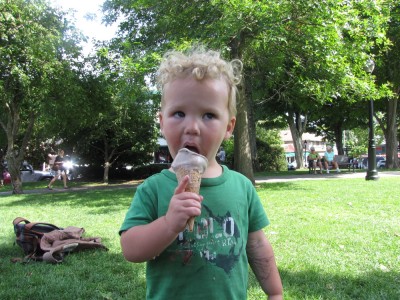 Lijah eating his ice cream in the park wearing a blissful expression