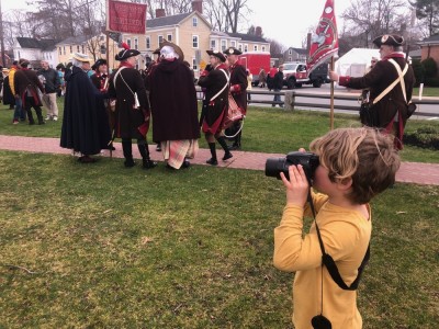 Elijah taking pictures at the Pole Capping parade