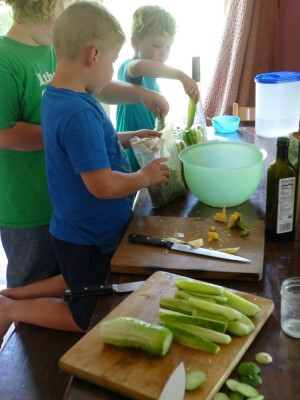 the boys making pickles at the kitchen table