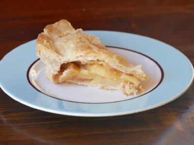a slice of apple pie on the table
