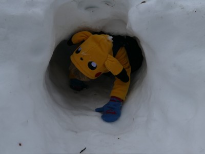 Lijah pikachu crawling out of a snow fort