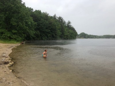 Elijah wading into Freeman Lake in the rain