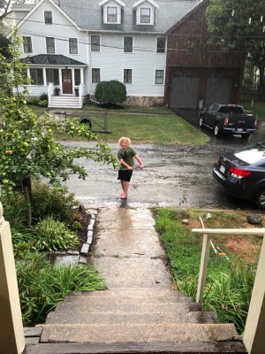 Harvey dancing in the rain in front of our house