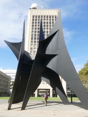 Harvey under a big abstract sculpture at MIT