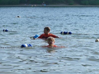 Zion and Elijah swimming by the ropes at Walden Pond
