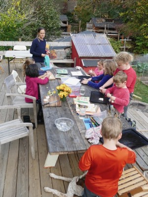 kids playing with bread dough around the table on our deck