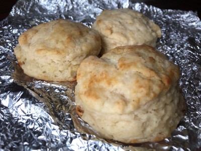 three sourdough biscuits on a sheet of tinfoil