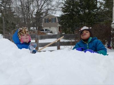 Lijah and Kamilah in the snow, making silly faces