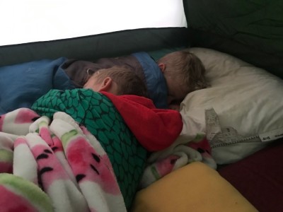 Zion and Lijah sleeping in the tent