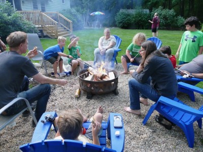 the boys and members of our community group around a firepit