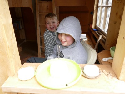 Harvey and Zion playing in the play house
