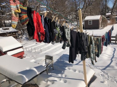 laundry on the line in the snowy backyard