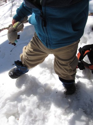 Lijah's booted feet stomping the snow
