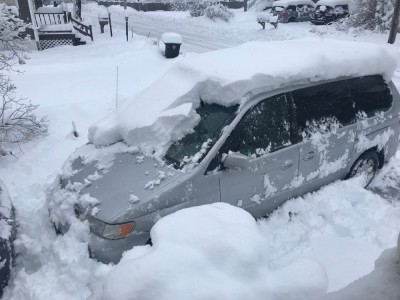 the van under about a foot of snow