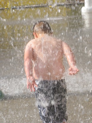 Harvey running under a heavy spray of water