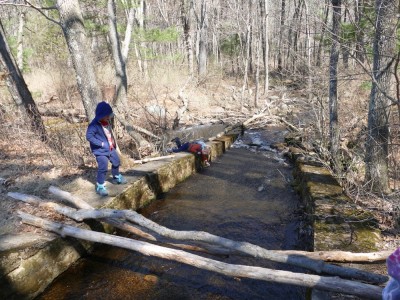Zion and Lijah playing by a spillway