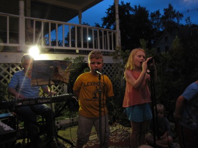 Harvey and Megan singing with the mics