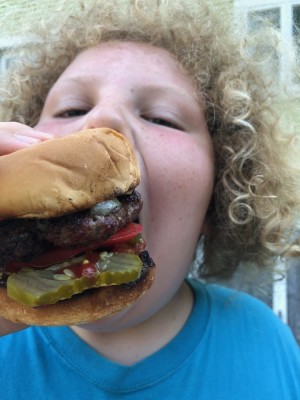 Harvey chomping a big burger