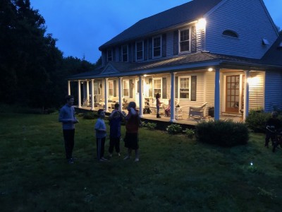 the boys talking on friends' lawn at dusk