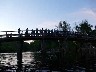 singers on the Old North Bridge at twilight
