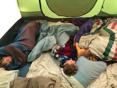 the boys asleep in the tent