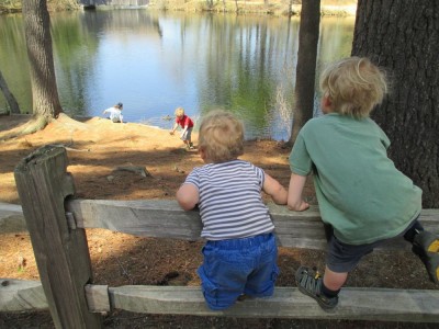 zion and elijah watching harvey play in a lake