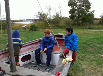kids chilling on one of the grounded boats