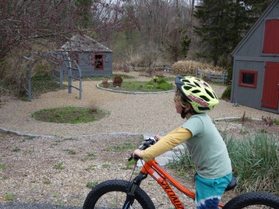 Elijah on his bike in a garden spot