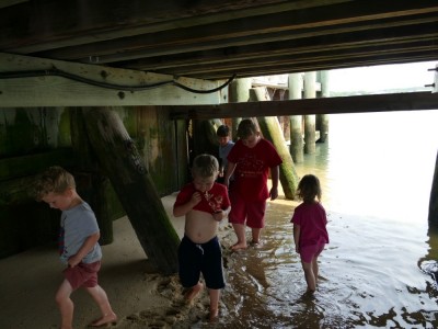 the boys and friends under the pier in Welfleet