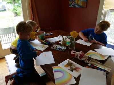 the boys painting at the kitchen table