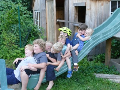 lots of kids smushed together at the bottom of our slide
