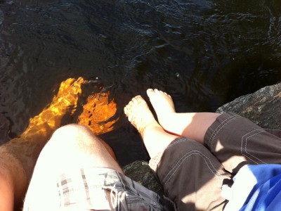 Dada and Harvey's feet dangling in the Concord River