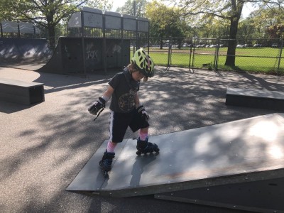 Elijah on rollerblades at the skate park