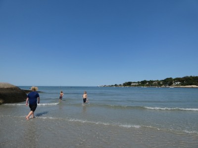 the boys walking in the shallow water at Wingaersheek beach