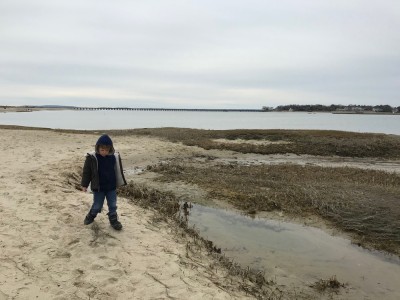 Lijah on the beach in wintery clothes