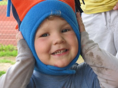 Lijah smiling in his fleece hat