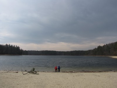 Harvey and Zion by Walden Pond under a stormy sky