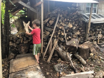 Elijah stacking firewood